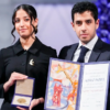 The children accepted the award on behalf of the imprisoned Iranian Nobel laureate