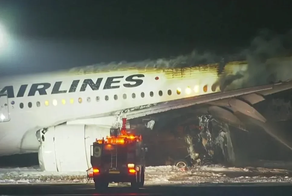 Japanese plane catches flames after landing